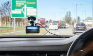 Dashcam view busy road - ALTA SURVEY Dallas Dashcam view of cars ahead on a busy road, used to illustrate a traffic study on viral near-miss risks