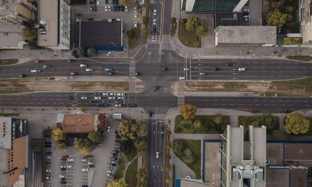 Aerial view of a signalized urban intersection illustrating the type of roadway planning a professional engineering company provides