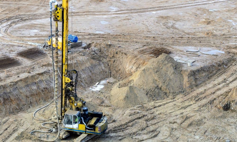 Drilling rig performing soil testing as part of geotechnical engineering at an industrial construction site